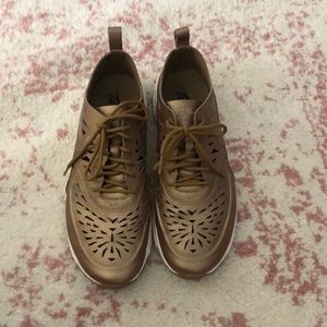 Nike cutout gold shoes